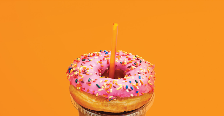 Milk being poured into coffee